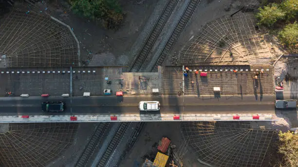 Aerial. High-altitude works. Bridge restoration. Asphalt pavement renovations. Top view from drone.