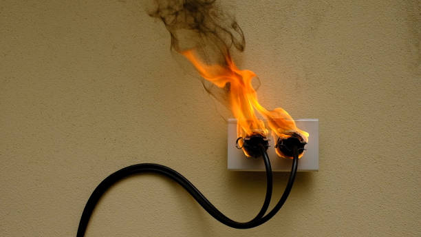 istock On fire electric wire plug Receptacle on the concrete wall background 1278826076