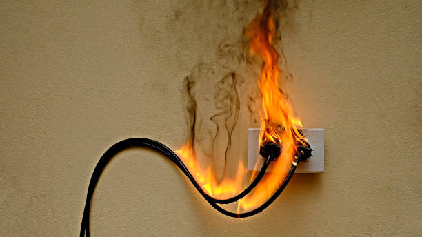 istock On fire electric wire plug Receptacle on the concrete wall background 1278826078
