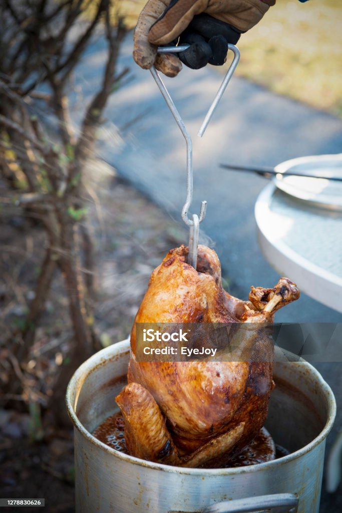 Thanksgiving Fried Turkey Close-up of frying Thanksgiving turkey Turkey Meat Stock Photo