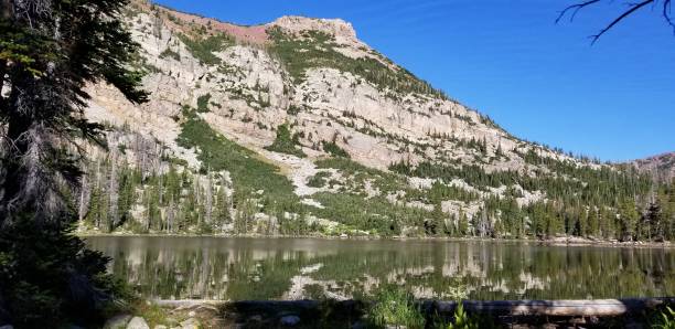 istock Sun Lit Cliffs of Mt. Marsell Reflected on a Lake, Uinta National Forest, Utah 1278830912