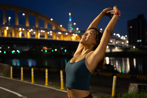 istock Young lady stretching arm and shoulder outdoors 1278830969