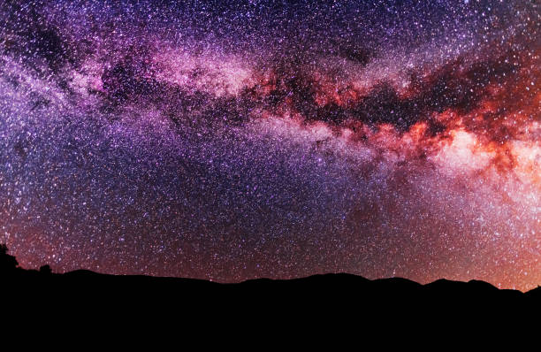 istock Beautiful bright milky way galaxy over the hill. 1278830980