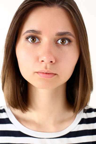 istock Charming young woman looking at camera with serious expression 1278831767