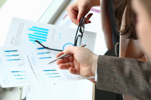 istock Business colleagues discussing statistics report at work 1278831904