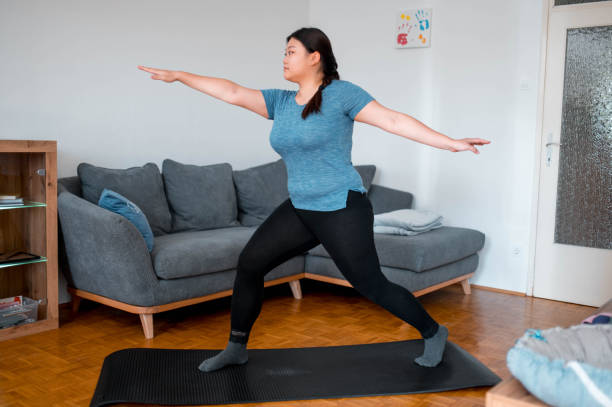 istock Asian Woman In Warrior Position At Home 1278833238