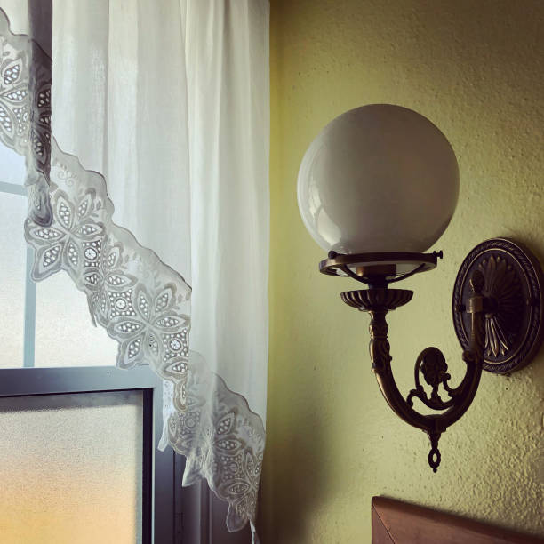 Globe Lamp with Lace Curtain stock photo