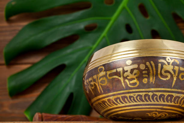 istock Tibetan singing bowl with monstera leaf 1278836340
