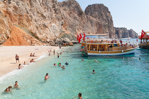 Adrasan, Antalya/Turkey-September 25 2020: Tour boat visit suluada island region and tourists enjoy sea.