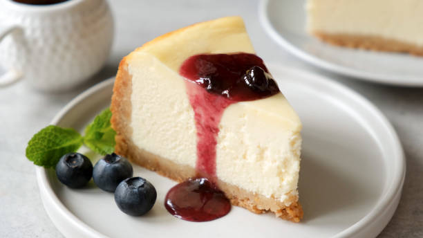 istock Slice of cheesecake with blueberry sauce 1278838721