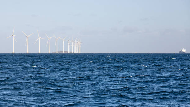 istock Panoramic view of offshore windmill farm. 1278838925