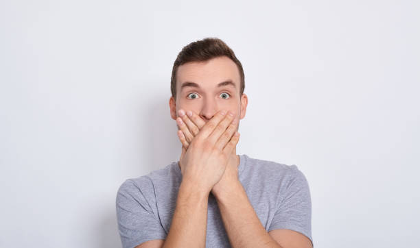 istock The shocked man covered his mouth with his hands. 1278844378