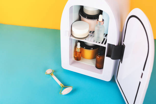 istock Mini fridge on yellow and blue background. Minimal composition. 1278844405
