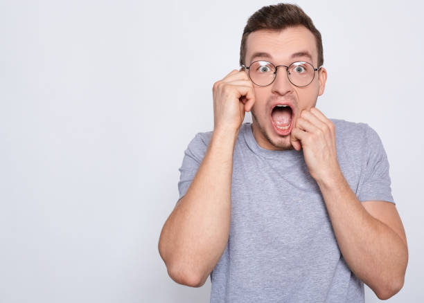 istock A shocked young man screams. 1278844535