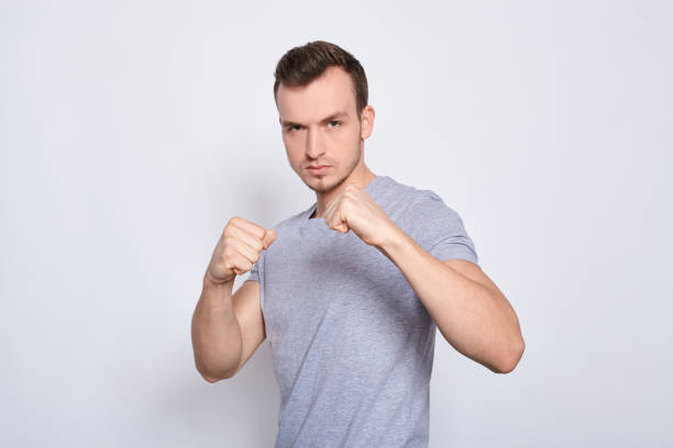 istock A sporty young guy in a boxing stand. 1278844575