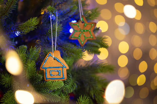 istock Homemade gingerbread as decoration on christmas tree, selective focus 1278845416