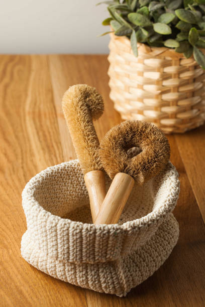 Coconut brushes for washing dishes on a wooden table. Concept zero wast.