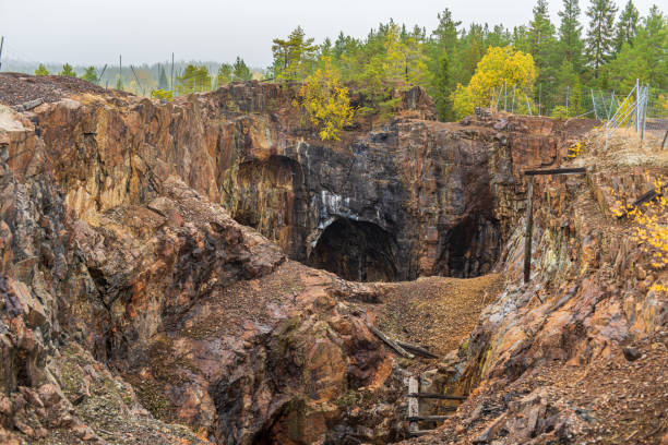 Old closed down open pit mine in Sweden stock photo