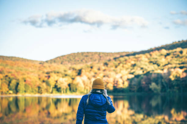 istock Young Woman in Autumn Landscape. 1278847145