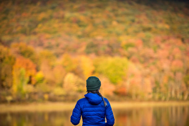 istock Young Woman in Autumn Landscape. 1278847209