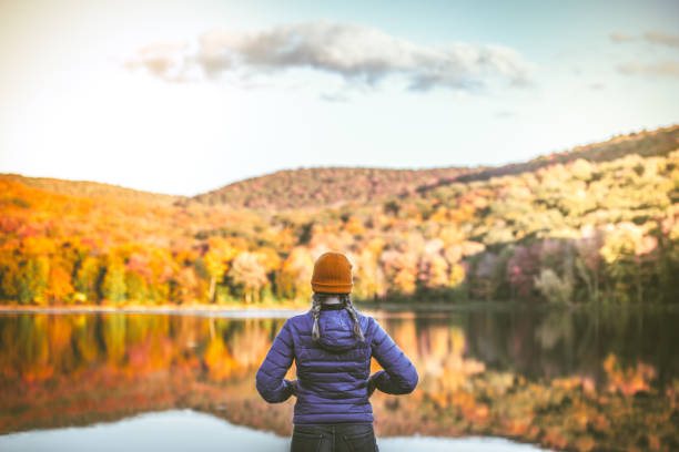 istock Young Woman in Autumn Landscape. 1278847252