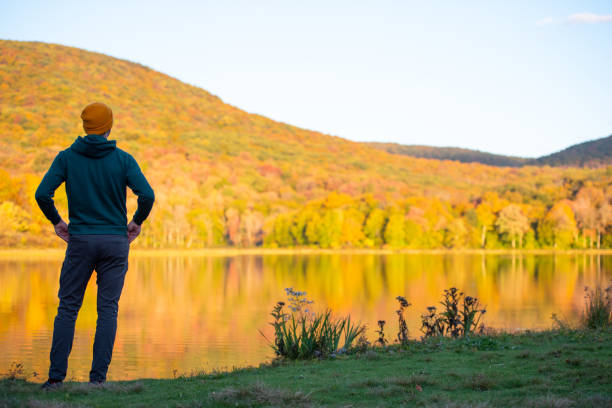 istock Young man surrounded by vibrant autumn colors. 1278847291