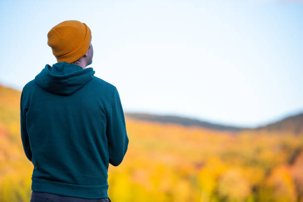 istock Young man surrounded by vibrant autumn colors. 1278847329