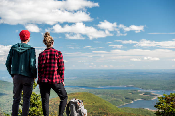 istock Young couple at the top of a beutiful mountain. 1278847823
