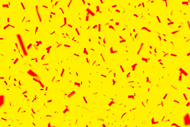 istock Red confetti on a yellow background. Bright holiday background 1278848947