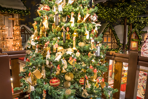 Decoration of the Christmas tree in a store