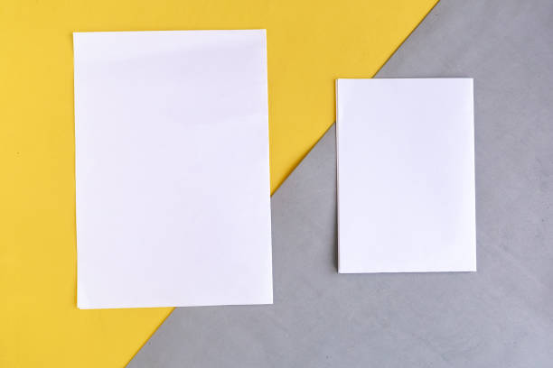 istock Two white mockup blanks on geometric grey and yellow background, copy space for the text 1278851084