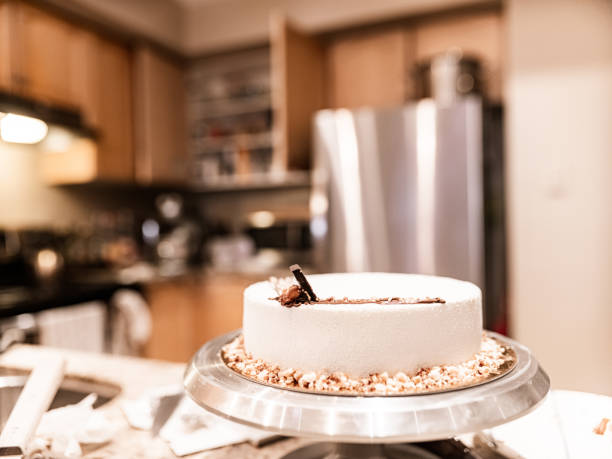 Brand new sweet cake on the kitchen counter. Interior of private home.