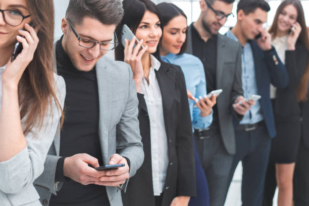 istock group of diverse young people use their smartphones 1278853156