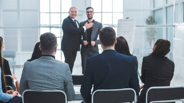 istock Manager congratulating the best employee at a meeting 1278853257