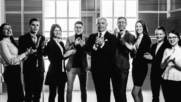 istock group of happy employees applauding their success 1278853387