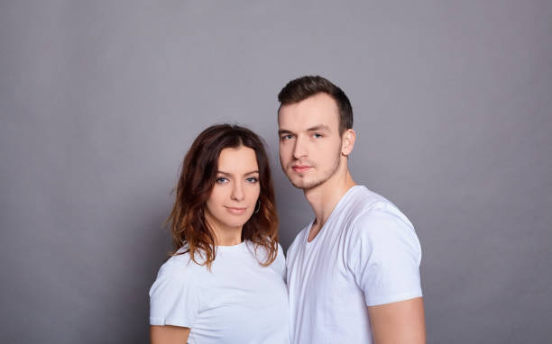 istock A beautiful young couple in white T-shirts. 1278854441