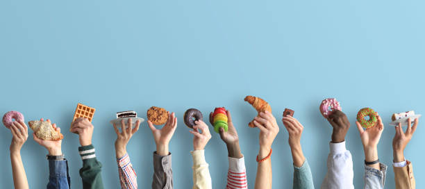 istock People are holding different desserts in their hands. 1278855224