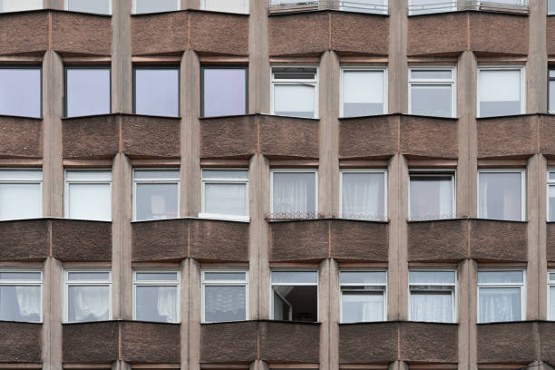 istock Old residential building facade with one window open 1278855556