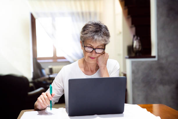istock Senior woman working on laptop 1278856429
