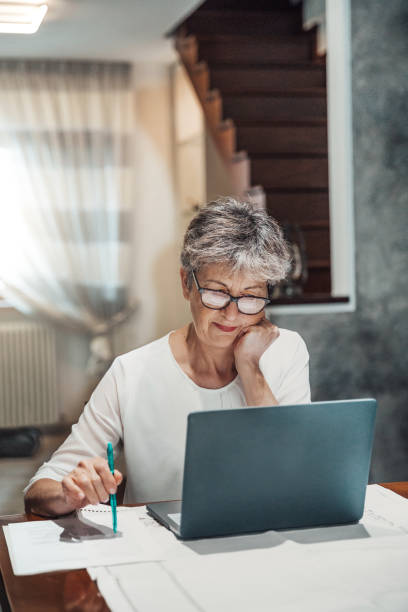istock Senior woman working on laptop 1278856462