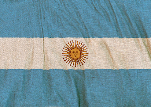 Flag of Argentina on a crumpled canvas background