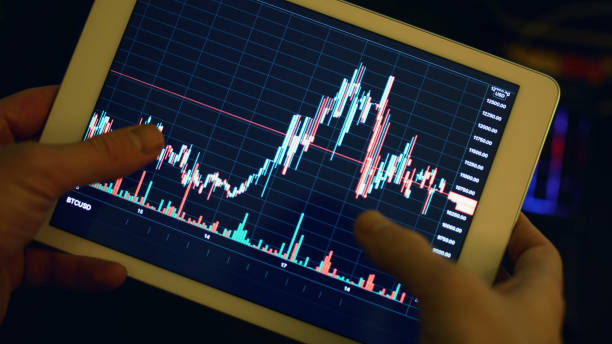 istock Digital Tablet Mobile Stock Exchange, Bitcoin and US Dollars 1278857527