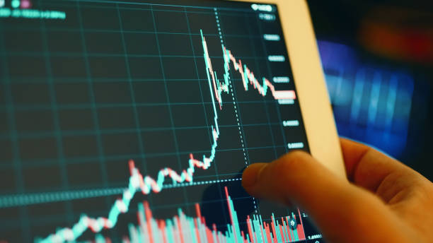 istock Digital Tablet Mobile Stock Exchange, Bitcoin and US Dollars 1278857559