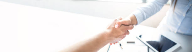 Business people shaking hands, finishing up meeting. Business people shaking hands, finishing up meeting. Successful businessmen handshaking after good deal. global business handshake stock pictures, royalty-free photos & images