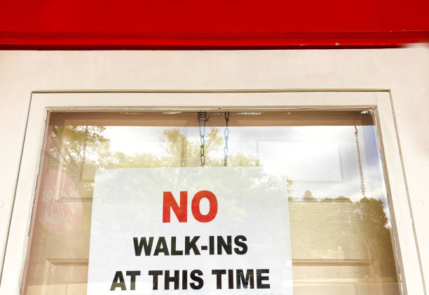 istock Pandemic Sign Reading: NO Walk-Ins At This Time 1278858358