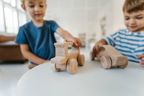 istock Little boys playing with toys at their home 1278858687