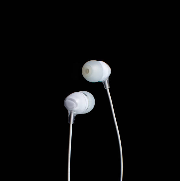 istock white headphones on a black background.copy space. 1278861713