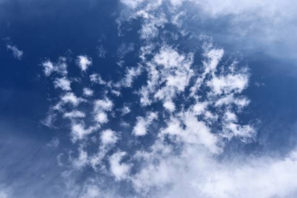 istock Beautiful fluffy white cloud formations in a deep blue summer sky 1278863364