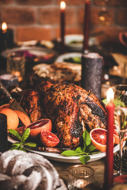 istock Christmas table with roasted turkey, chocolate cake and candles 1278863997