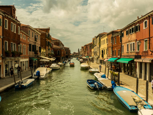istock Venice Murano view into a canal with shops and boats 1278864991